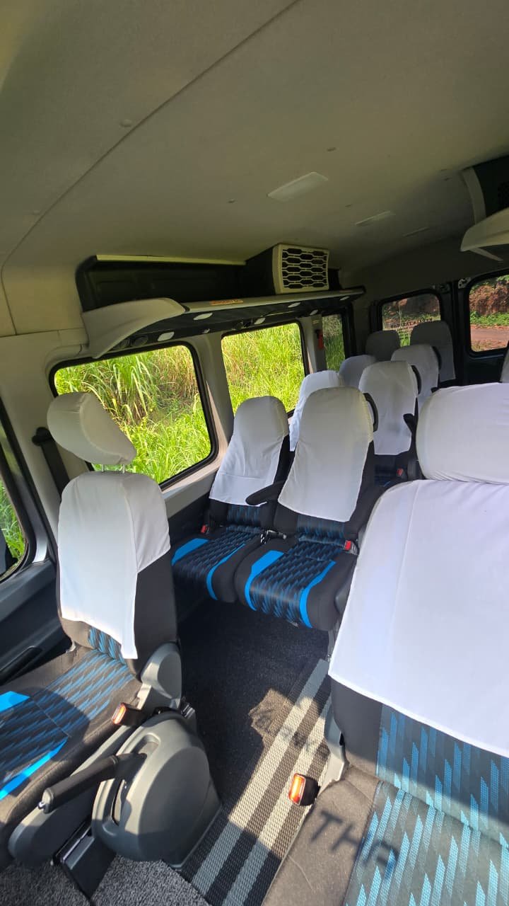 Force Urbania luxury van on a Munnar tea plantation road
